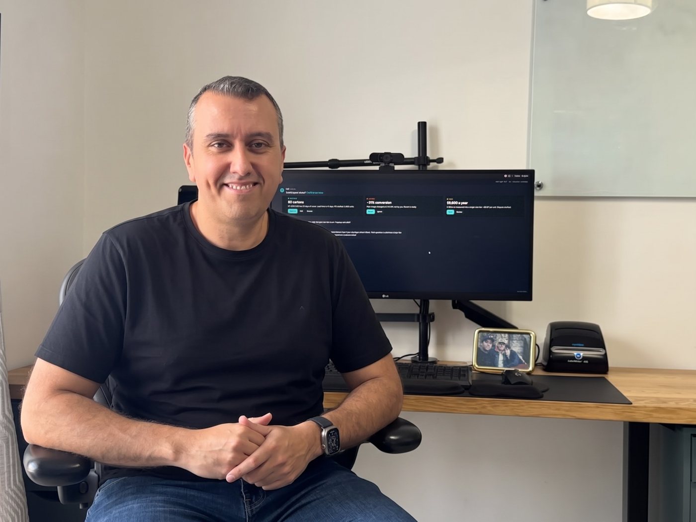 Ramon Gonzalez at his desk, with the morning alerts on the monitor behind him